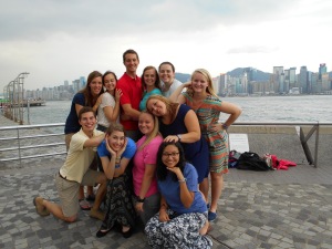 Awkward family photo with the team, Hong Kong in the background!